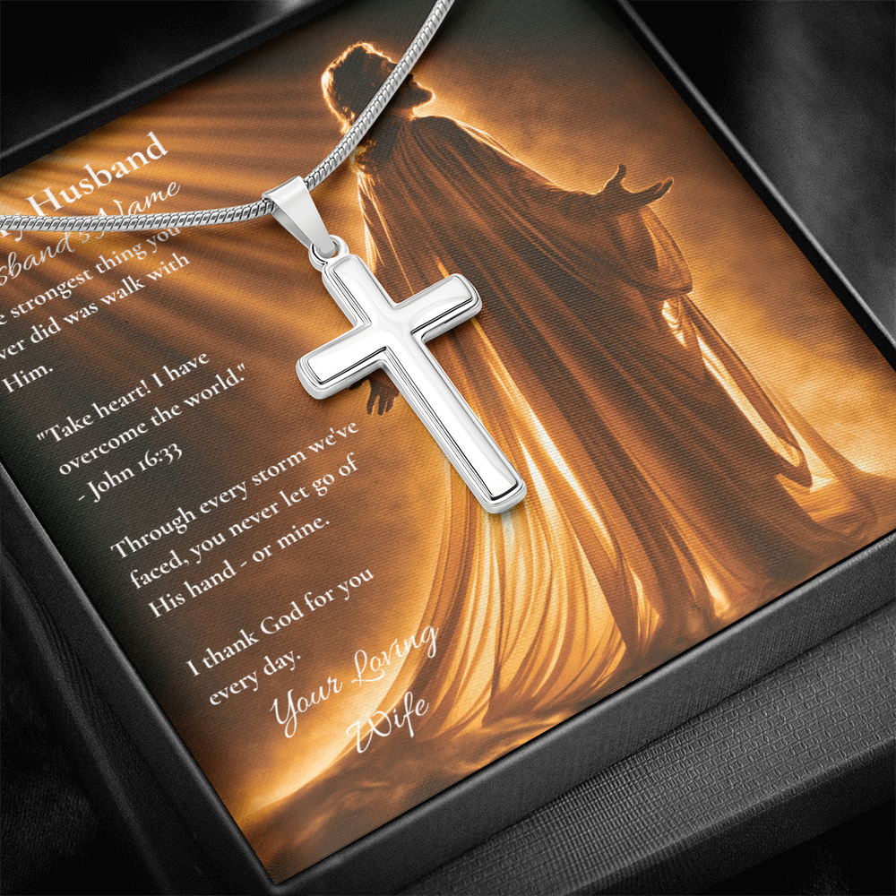 Silver cross pendant necklace on a To My Husband message card, warm background