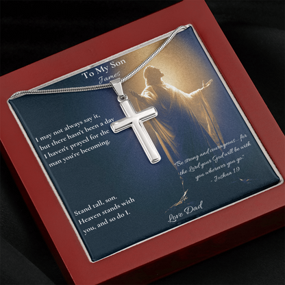 Silver cross necklace and personalized Joshua 1:9 son card in a red gift box, angled view