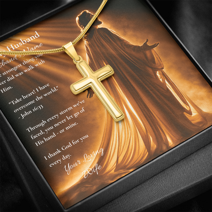 Yellow gold cross pendant on a To My Husband card with John 16:33, warm background