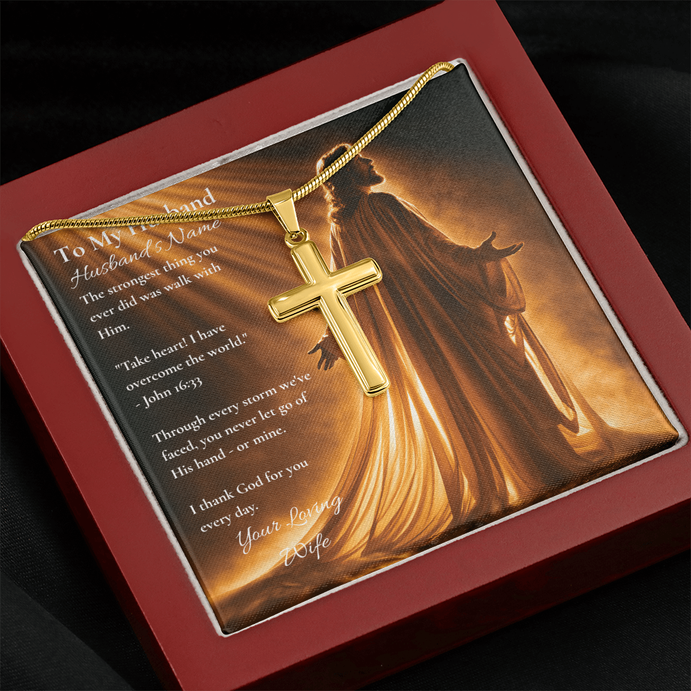 Gold cross necklace and To My Husband card with John 16:33 in a red luxury box on fabric